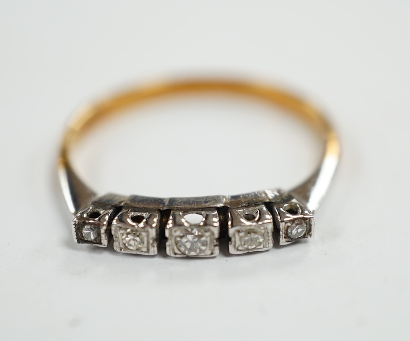 An 18ct and graduated five stone diamond chip set half hoop ring, size N, gross weight 2.5 grams. Condition - poor to fair